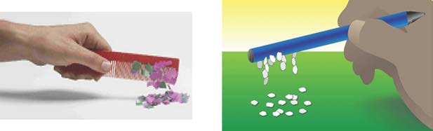 A hand holding a comb above small pieces of paper that are jumping up to it, and a hand holding a pen with small pieces clinging underneath it