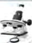 A finished temporary slide is placed on the stage of a microscope like this and then viewed.