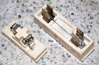 What a fuse wire looks like when it is set into its holder and socket.