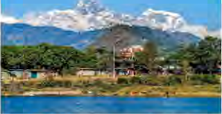 Phewa Lake, with the snow-capped Annapurna range rising behind the town of Pokhara.