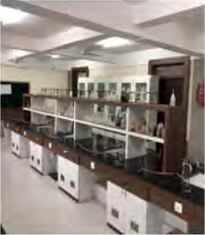 A science laboratory: benches, sinks and apparatus kept ready for work.