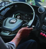 The speedometer in front of the driver shows how fast the bus is moving at that instant.