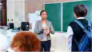A teacher asks a student who has arrived late for the reason.