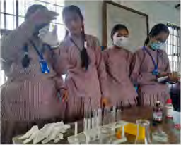 Students watching closely for the change taking place in the substances held in the test tubes.