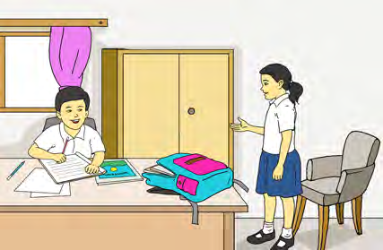 Anu asks Mahesh to pass her a book while he is reading at his desk.