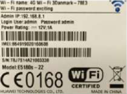 The label on a router's adapter. Its power rating reads 12V, the voltage the transformer inside must give out from the 220 V mains.