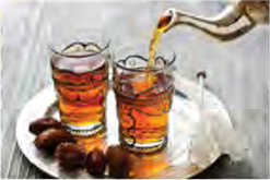 Sherbet drinks and dates laid out for the Mehregan feast in Iran.
