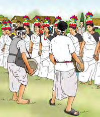 Drummers in white leading a street procession during a festival.