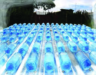 Purifying water by the SODIS method. Transparent bottles filled with water lie in the sun on a roof, where the Sun's ultraviolet rays destroy the germs in the water.