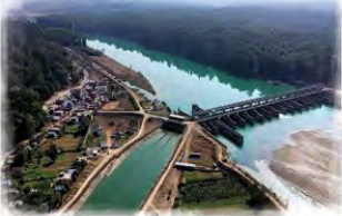 A river barrage feeding a wide irrigation canal