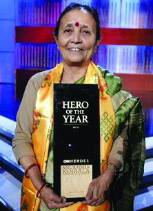 Anuradha Koirala holding her CNN Hero of the Year award. Her life story is told in her own words, all in the past tense.