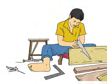 A carpenter cuts wood with a saw to make furniture.