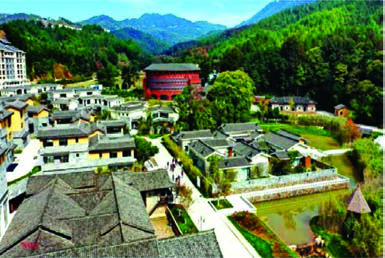 The same village today: new buildings, a pond and paved lanes where the fields used to be.