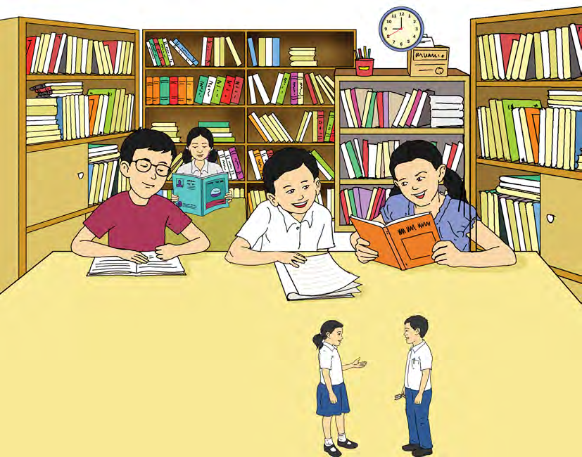 A school library is a silent zone. The two friends at the front remind each other to keep quiet and read.