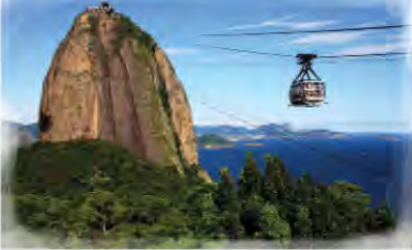 A glass-sided cable car carrying visitors towards the summit