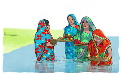 Women standing in the river with trays of offerings, praying to the sun at Chhath.