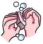Lathering with soap between the palms.