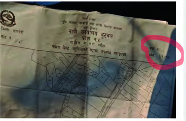 A land plot map, with the scale it was drawn to printed on the sheet itself.