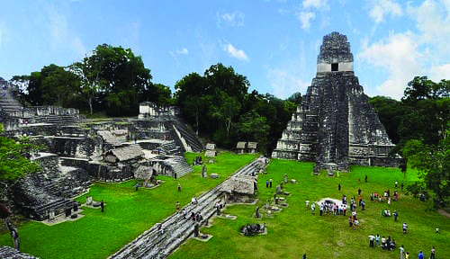 The plazas, temples and stepped pyramids of a Classic Maya city, unearthed by excavation and now visited by scholars and tourists.