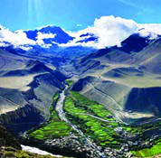 A river winding through a deep Himalayan valley. A remote place like this is reached by a long bus ride and days of walking, and describing that journey in English is what this unit practises.