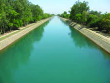 A canal, a long man-made waterway with straight banks, the kind of structure the listening passage describes.