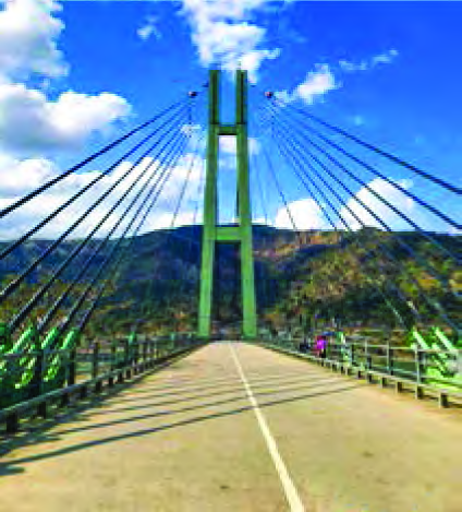 The Karnali bridge, standing on a single tower and held by steel rods. Because of the high elasticity of steel, the rods carry enormous loads without losing their original shape.