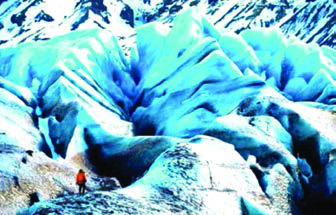 Towering blue ridges of glacier ice with a lone climber at their base: the exquisite images that make Chasing Ice worth watching on the biggest screen possible.