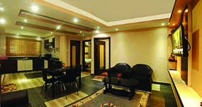 The living space of an apartment. Comparing it with a house is the question the listening conversation turns on.