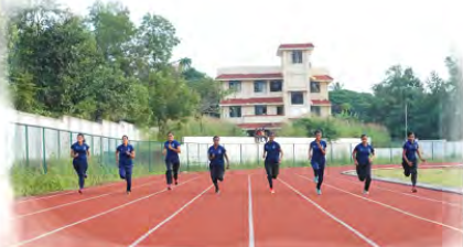 Athletics: runners race each other along the lanes of a track.