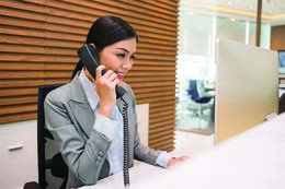 A hotel receptionist answering the telephone: the voice a customer hears when booking a room.