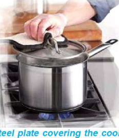 A steel lid over cooking food heats up almost at once, so it is lifted with a cloth, never with bare fingers.