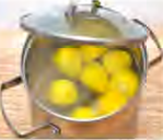 Lemons kept under salt. The salt pulls water out of the fruit, so microorganisms get no chance to grow on it.