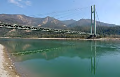 The two edges of a bridge cross to the far side keeping one fixed width.