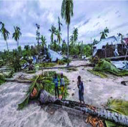 Homes flattened and palm trees snapped by a cyclone: a warmer atmosphere feeds more violent storms.