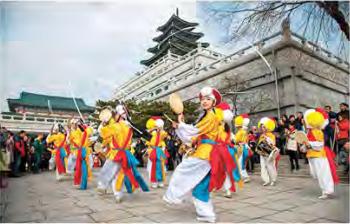 Dancers in bright traditional dress perform during Chuseok in South Korea.