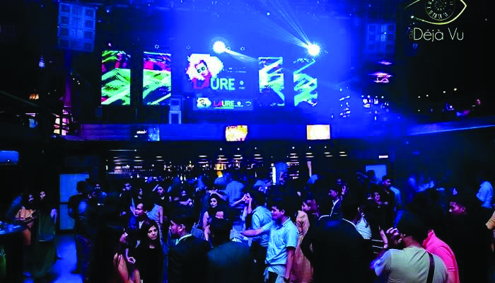 A crowded disco with lights and music: the setting where the narrator watched four polite requests fail one after another.