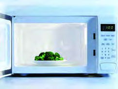 A microwave oven. The microwaves produced inside it vibrate the water molecules in the food, and the food cooks.