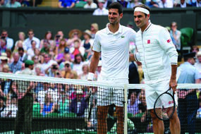 Novak Djokovic and Roger Federer at the net before their famous 2019 final.