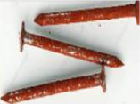Rusted iron nails: the iron has changed into a new brown substance, rust.