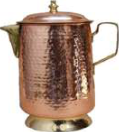A copper jug. Copper is a shiny metal that can be hammered into shape.